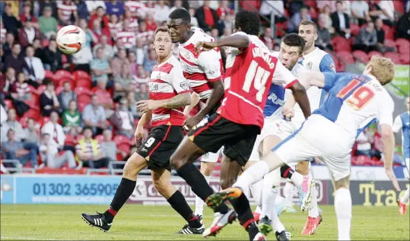  ?? PICTURES: Action Images ?? FLYING START: Doncaster’s Theo Robinson scores on his debut
