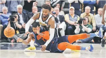  ?? — USA TODAY Sports photo ?? Oklahoma City Thunders’ Paul George makes a pass while sitting on the floor against Indiana Pacers’ Wesley Matthews during the fourth quarter at Bankers Life Fieldhouse.