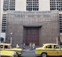  ?? PHOTO: REUTERS ?? The Reserve Bank of India building in Kolkata. The bank lowered its policy repo rate by 25 basis points to 7.5 percent yesterday, its second cut this year on the back of easing inflation. Few had expected the move just days after the government...