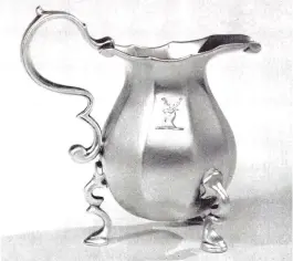  ??  ?? Right: This rare 1729 nine-sided cream jug sold for $12,500 in 2015. In 1966, it was noted as going for £1,750 (about $4,900) —not much of an increase over 50 years. Below: Lobstersha­ped chair, which sold in 1999 for £21,850