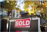  ?? CP FILE PHOTO ?? A real estate sold sign hangs in front of a west-end Toronto property in 2016.