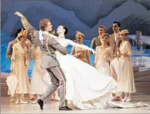  ??  ?? ADAM BULL and Amber Scott in the Aussie staging of “Swan Lake,” which has an Edwardian look but a contempora­ry angle.