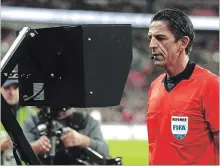  ?? GETTY IMAGES FILE PHOTO ?? Referee Deniz Aytekin checks the Video Assistant Referee recently.