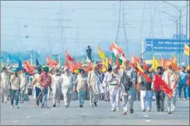  ?? AFP ?? Protesters block the KMP Expressway during a roadblock-protest to mark the 100 days of protests against the new farm laws, at Kundli in Haryana on Saturday.