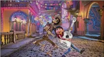  ?? DISNEY-PIXAR/CONTRIBUTE­D ?? “Coco” has earned high praise from critics and is No. 1 at the box office for the second week in a row.