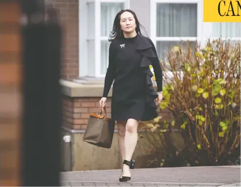  ?? DARRYL DYCK / THE CANADIAN PRESS ?? Meng Wanzhou, chief financial officer of Huawei, leaves her home to attend a hearing at B.C. Supreme Court in Vancouver on Wednesday.