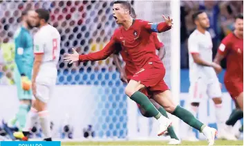  ?? AP ?? Portugal’s Cristiano Ronaldo celebrates after he scored his third goal with a free kick during the Group B match between Portugal and Spain at the 2018 World Cup in the in Sochi, Russia, yesterday.