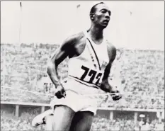  ?? AFP via Getty Images ?? Jesse Owens crosses the finish line of the 200 meters event that he won during the 1936 Olympic Games in Berlin.