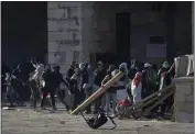  ?? MAHMOUD ILLEAN — THE ASSOCIATED PRESS ?? Palestinia­ns clash with Israeli security forces at the Al Aqsa Mosque compound in Jerusalem's Old City on Friday.