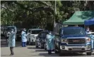  ?? Photograph: Barcroft Media via Getty Images ?? Health workers administer Covid-19 tests for people who may be unable to afford health insurance in Alatamonte Springs, Florida.