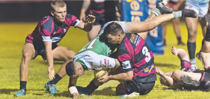  ?? Picture: Kevin Farmer ?? DESPERATIO­N: Valleys players Dylan Chown (left) and Brock Diment attempt to stop a Wayne Kennedy try for Beenleigh in a pre-season trial at Herb Steinohrt Oval,