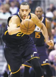  ?? LM Otero / Associated Press ?? Jazz center Rudy Gobert starts the fastbreak after coming up with a steal during the second half of a victory in Dallas.