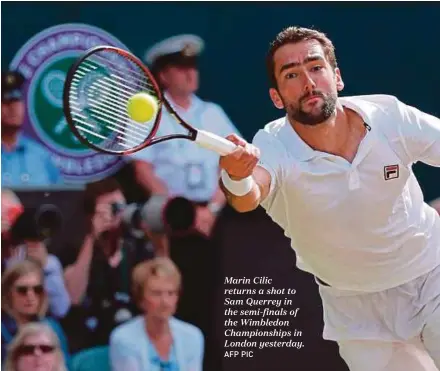  ?? AFP PIC ?? Marin Cilic returns a shot to Sam Querrey in the semi-finals of the Wimbledon Championsh­ips in London yesterday.