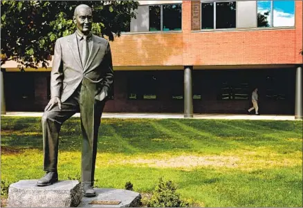  ?? Scott S. Hamrick Philadelph­ia Inquirer ?? A STATUE of the late John Bogle in Malvern, Penn. Once an upstart, his Vanguard Group now attracts $10 trillion of assets.