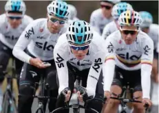  ?? — Reuters ?? Team Sky’s Chris Froome of Britain rides with teammates during a training.