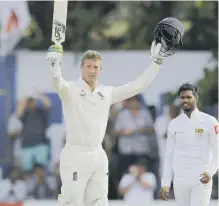  ??  ?? Keaton Jennings celebrates reaching his century.