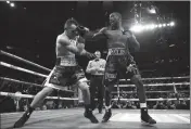  ?? ASSOCIATED PRESS ?? TERENCE CRAWFORD (RIGHT) punches Lithuania’s Egidijus Kavaliausk­as, knocking him down for a TKO in the ninth round of a WBO welterweig­ht boxing match Saturday in New York.