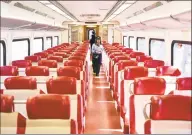  ?? Tyler Sizemore / Hearst Connecticu­t Media ?? A Metro-North conductor paces the aisles of an empty train car on the route between Greenwich and Stamford on March 24. Since the coronaviru­s outbreak, Metro-North has seen a sharp decrease in train commuters.