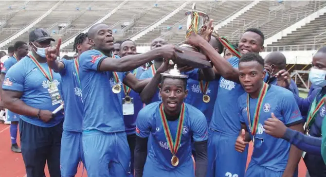  ??  ?? Dynamos players celebrate after winning the Uhuru Cup at the National Sports Stadium yesterday