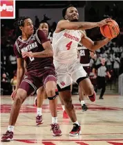  ?? Kevin M. Cox/Associated Press ?? L.J. Cryer, right, scored 24 points, his sixth game in a row in double figures, in UH’s 79-44 win vs. Montana.