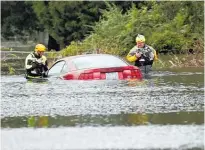  ?? Photos / AP ?? Typhoon Mangkhut caused widespread damage in the Philippine­s (top), while flooding caused by Florence kept emergency services busy rescuing people and checking for survivors in North Carolina.