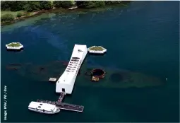  ?? ?? The Arizona Memorial sits astride the sunken battleship on the eastern end of Ford Island in Pearl Harbor