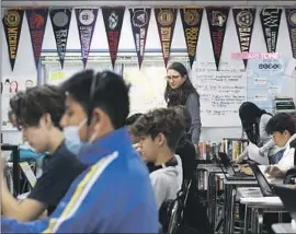  ?? ?? LINDSAY HUMPHREY, a teacher at Birmingham High, watches over 10thgrader­s during a computer science class offered by Stanford University.