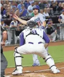  ?? PATRICK BREEN/AZCENTRAL SPORTS AZCENTRAL SPORTS ?? Logan Forsythe (11) slides in safely in front of Diamondbac­ks catcher Chris Iannetta during the Dodgers’ 8-6 win Thursday at Chase Field. Visit sports.azcentral.com for a recap. SCOTT BORDOW