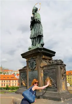  ??  ?? Clockwise from left: Jazz musicians put up a performanc­e on Charles Bridge; tourists regularly rub the plaque beneath the statue of St. John Nepomuk for good luck; Jatka 78 is a slaughterh­ouseturned-theatre in Praha 7. Opposite: Trdelnik is a cinnamon pastry found everywhere on Prague’s streets.