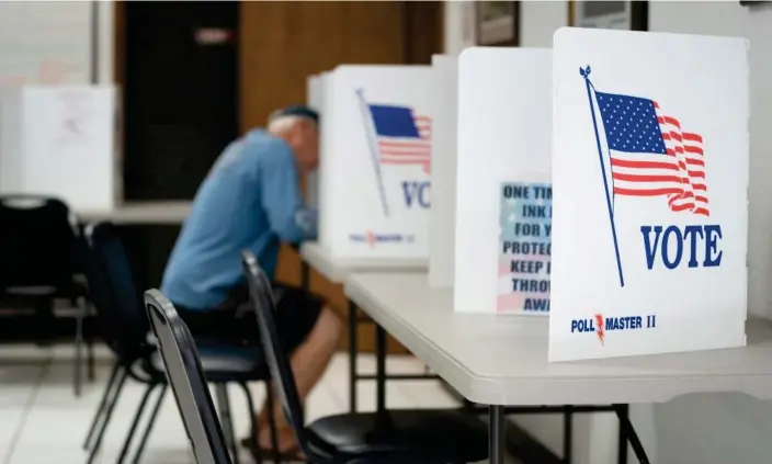  ?? ?? A man votes in a booth in Mt Gilead, North Carolina. Photograph: Sean Rayford/Getty Images