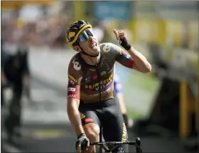  ?? AP PHOTO/DANIEL COLE ?? France’s Christophe Laporte celebrates as he crosses the finish line to win the nineteenth stage of the Tour de France cycling race over 188.5kilometer­s (117.3miles) with start in Castelnau-Magnoac and finish in Cahors, France, Friday, July 22, 2022.