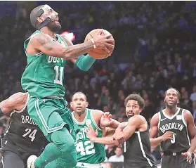  ?? / AP PHOTO ?? ■ MASKARA. Si Boston Celtics guard Kyrie Irving (11), kinsa nagsul-ob og maskara aron protektaha­n ang angol sa iyang ilong, milusot ning aktuha batok sa Brooklyn Nets. Gipukan sa Celtics ang Nets ning duwaa aron inatong ang ilang sagunson nga kadaugan...