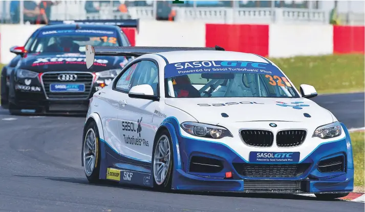  ?? Pictures: Dave Ledbitter. ?? NEW WINNER. Gennaro Bonafede (Sasol BMW GTC) leads Michael Stephen (Engen Xtreme Audi A3 GTC) during Saturday’s Sasol Global Touring Car race at Killarney.