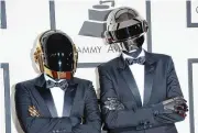  ?? MERRITT/GETTY IMAGES/TNS JASON ?? Guy-Manuel de Homem-Christo, left, and Thomas Bangalter of Daft Punk attend the 56th Grammy Awards at Staples Center on Jan. 26, 2014, in Los Angeles.