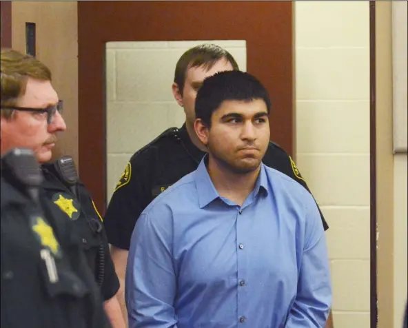  ??  ?? Arcan Cetin is escorted into Skagit County District Court by Skagit County’s Sheriff’s Deputies on Monday. Cetin is being held under a magistrate’s warrant which will give Skagit County prosecutor­s 30 days to file charges in relation to the Cascade...