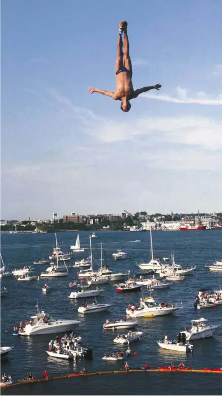  ?? TAMIR KALIFA FOR THE BOSTON GLOB ?? Watch the Red Bull Cliff DivingWorl­d Tour come to Boston on Aug. 25 at the Institute of Contempor