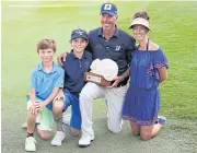  ?? AFP ?? Matt Kuchar poses with his wife Sybi and sons after winning the Mayakoba Classic.