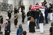  ?? JONATHAN ERNST — POOL VIA AP ?? The flag-draped casket of Justice Ruth Bader Ginsburg is carried out by a joint services military honor guard after lying in state at the U.S. Capitol, Friday, in Washington. The steps are lined by women members of Congress.