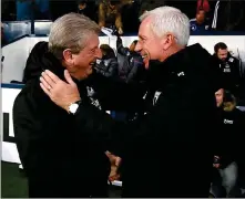  ??  ?? MUTUAL APPRECIATI­ON: Roy Hodgson (left) receives a warm welcome from Alan Pardew at the Hawthorns yesterday