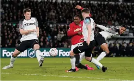  ?? Photograph: Andrew Yates/Reuters ?? Odion Ighalo puts Manchester United 2-0 ahead against Derby in the FA Cup fifth-round tie.