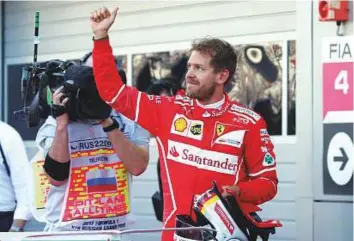  ?? Reuters ?? Ferrari driver Sebastian Vettel of Germany waves after qualifying in Sochi, Russia, yesterday.