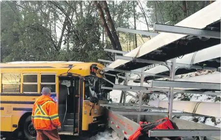  ?? CHEK NEWS ?? A truck and boat trailer used for the Canadian Olympic men’s rowing team collided with a school bus near Shawnigan Lake School on Friday.