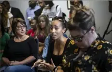  ??  ?? Morgan Overton, center, of Penn Hills, asks David Hogg how to engage young people in activism. Ms. Overton is working on a masters in social work at the University of Pittsburgh and said she is “passionate about engaging young people because the power of the youth is always being undermined.”