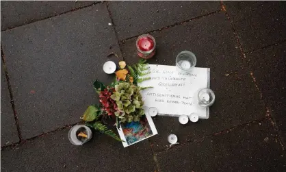  ??  ?? Flowers and a message reading ‘antisemiti­sm has no place here’ in front of the Hohe Weide synagogue in Hamburg, Germany. Photograph: Morris Mac Matzen/AFP/Getty