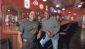  ?? JOE RONDONE/THE COMMERCIAL APPEAL ?? Eric Vernon and his father, Frank, own The BAR-B-Q Shop on Madison Avenue in Midtown.