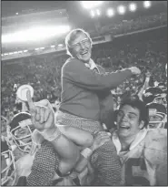  ?? AP file photo ?? Former Arkansas Coach Lou Holtz is carried off the field after leading the Razorbacks to a 31-6 victory over Oklahoma in the Orange Bowl in 1978. Holtz was inducted into the UA Sports Hall of Honor on Friday.