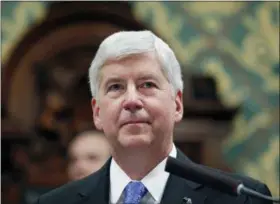  ?? AL GOLDIS — THE ASSOCIATED PRESS ?? In this former Michigan Gov. Rick Snyder delivers his State of the State address at the state Capitol in Lansing, Mich. In his final days in office, Snyder erased the felony drunken-driving conviction of Jim Jagger who pleaded for a pardon so he could seek a lucrative promotion as the next president of the Michigan Associatio­n of Certified Public Accountant­s.