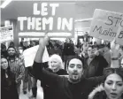  ?? ASSOCIATED PRESS ?? Supporters cheer as an Iranian citizen with a valid U.S. visa arrives at Los Angeles Internatio­nal Airport Feb. 2.