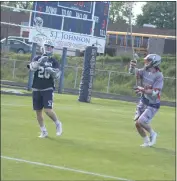  ?? STAFF PHOTO BY AJ MASON ?? La Plata’s Preston Pipes, left, looks to pass as he is defended by Jack Purcell of Northern in Monday’s SMAC boys lacrosse championsh­ip game. The Patriots won 17-2.