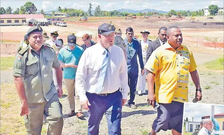  ?? Picture: BALJEET SINGH Picture: BALJEET SINGH ?? LEFT: Australian Prime Minister Scott Morrison accompanie­d by Minister for Defence and National Security Inia Seruiratu, right, during his visit to the Black Rock Camp in Nadi. BELOW: Australian Prime Minister Scott Morrison meets military personnel during his visit to the Black Rock Camp in Nadi.